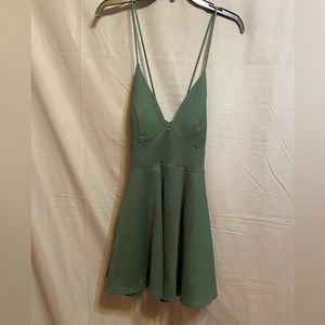 Dark green dress size medium with crisscross spaghetti straps. V-neck to sternum